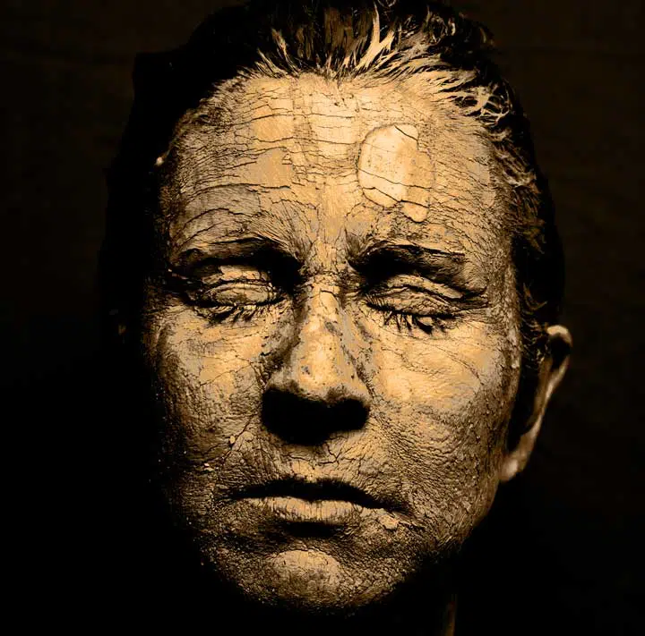 Image of a face that is so dry to look sandy. 