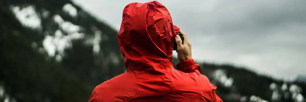 Image of a man in the mountains under a cold weather.