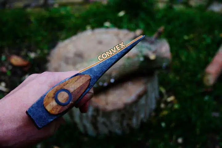 Photo of a convex axe head. 