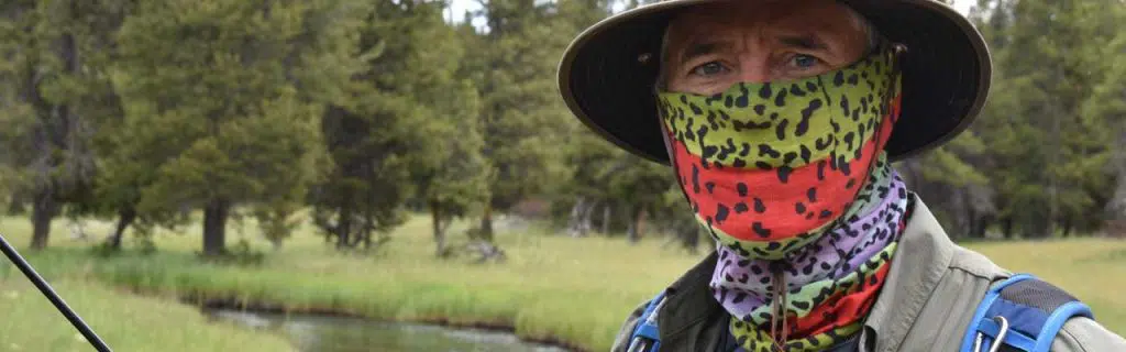 Photo of a fisherman wearing a fishing mask.