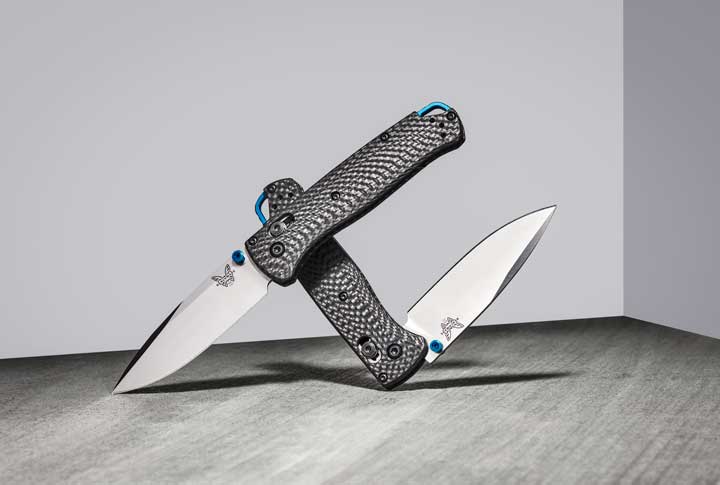 Staged photo of two benchmade bugout knives. 