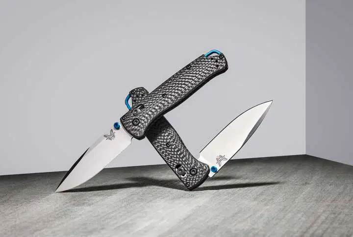 Staged photo of two benchmade bugout knives. 