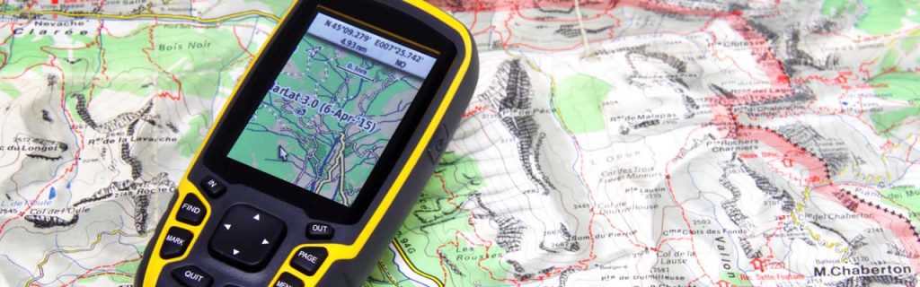 Photo of a Garmin GPS on a map. .