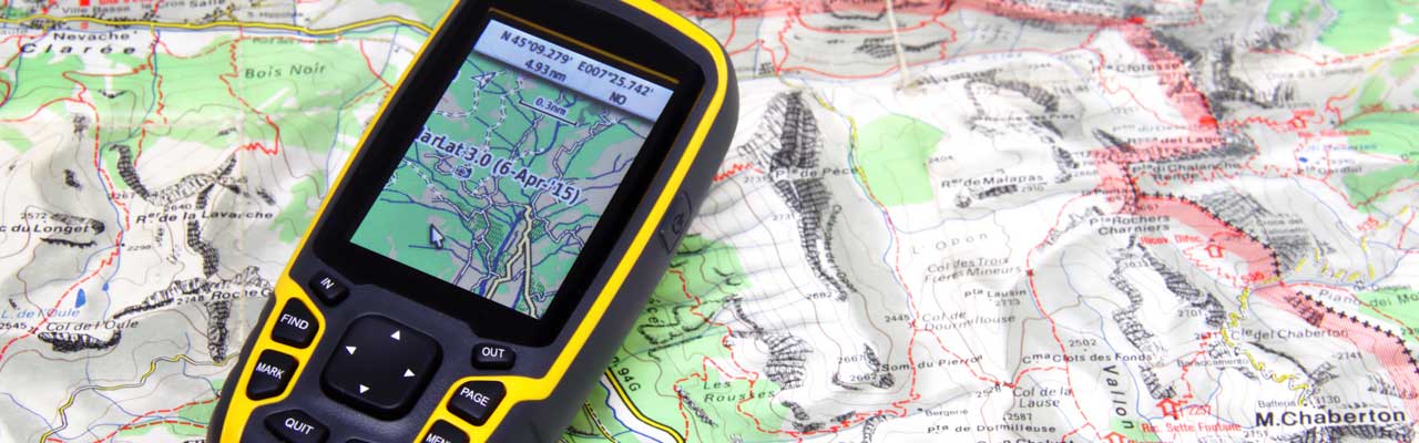 Photo of a Garmin GPS on a map. .