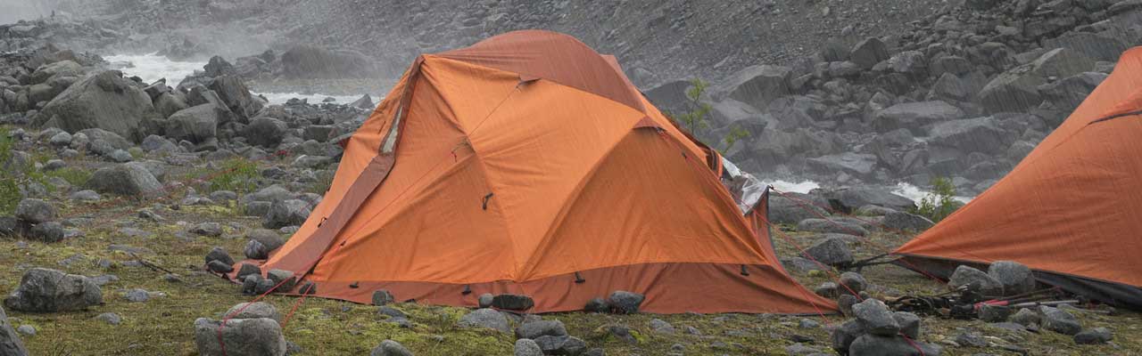 Photo of tents under a heavy rain.