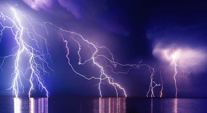 Do tents attract lighning? Photo of a thunderstorm with lightning coming from the water.