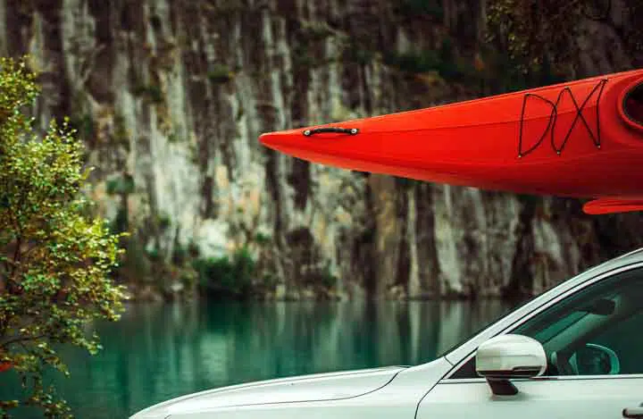 Red Kayak on the Car Roof. 