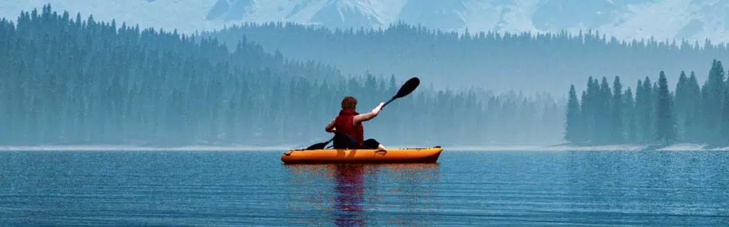 Man with canoe on the lake.