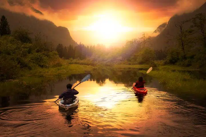 Kayaks surrounded by Canadian Mountain Landscape. 