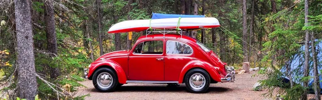 Well maintained camp site equipped with tent and a Kayak on roof rack ready to explore the local Saskatchewan river.