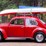 Well maintained camp site equipped with tent and a Kayak on roof rack ready to explore the local Saskatchewan river.