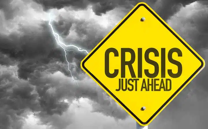 Crisis Just Ahead sign with a bad day. 
