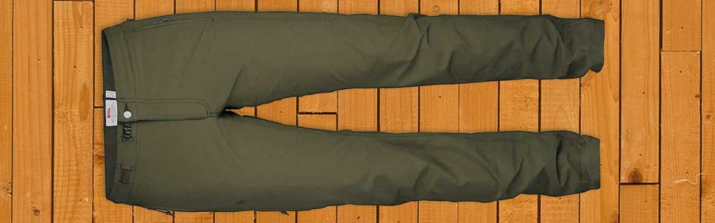 a pair of fjallraven pants on a wooden floor.