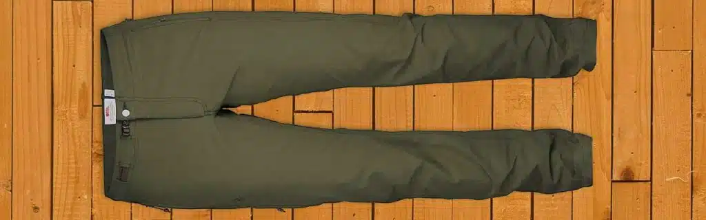 a pair of fjallraven pants on a wooden floor.