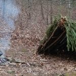 Blanket, shelter, fire in the forest.