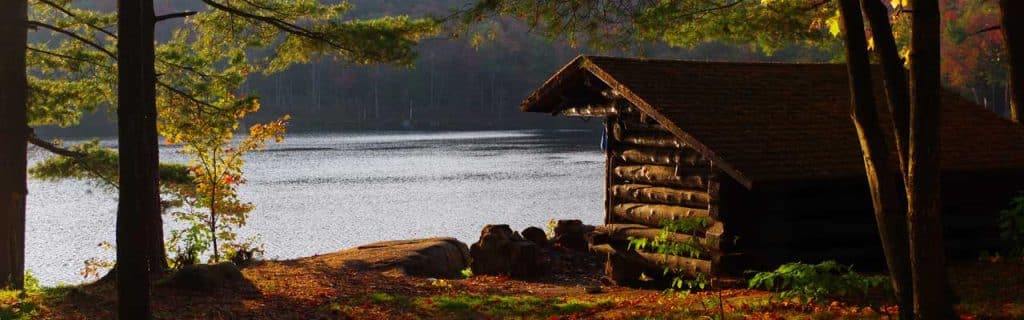 Vibrant fall foliage surrounds this primitive shelter.